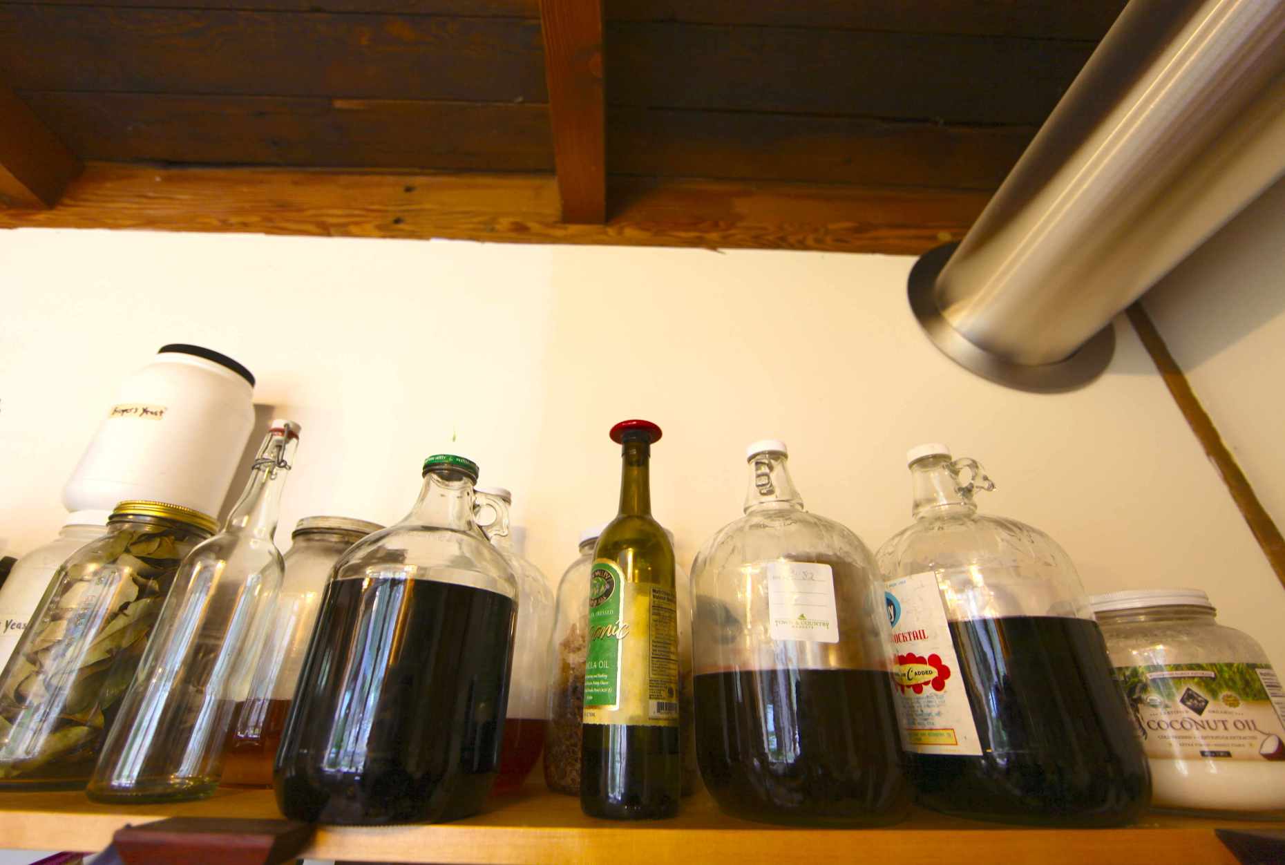 Plastic-Free Bulk Options: Oils & Maple Syrup Stored in Glass. Our Own Honey, too is Stored in Glass. Photo © Liesl Clark